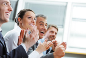 clapping people at meeting